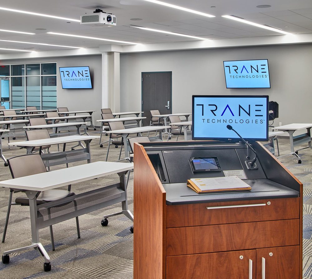 Corporate training room with AV lectern and displays